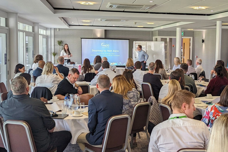 More than 40 people attended the Energy and Water event at Durham Cricket Club. This photo displays a room of people watching two speakers present a slideshow.